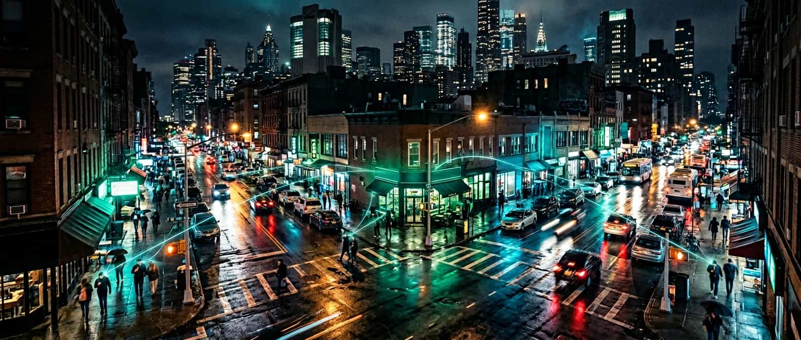 Aerial view of a city at night with glowing green connection lines between local businesses