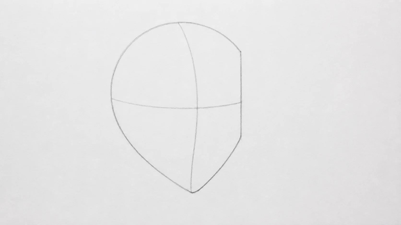A light pencil construction of a head showing a circle with one side flattened, a jawline angling down to the chin and the curved guide lines crossing the face